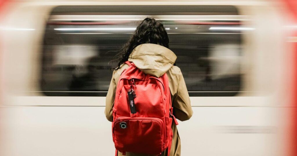 commuter-with-red-backpack-at-london-underground-station